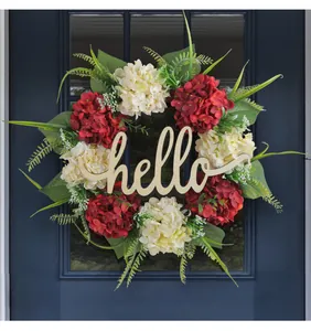 Detailed view of artificial hydrangea wreath with wooden hello sign for door decor