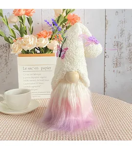 Close-up of plush gnome with a gradient purple beard and cute butterfly decoration
