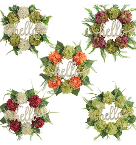 Detailed view of artificial hydrangea wreaths with wooden 'hello' signs in various colors.