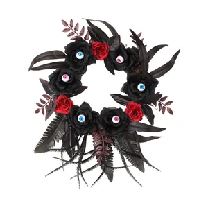 Creepy Halloween artificial wreath with black and red roses and realistic eyeballs