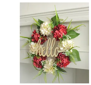 Close-up detail of artificial hydrangea wreath featuring a wooden hello sign centerpiece
