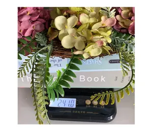 Detail view showing the 241g weight of the artificial hydrangea floral wreath decoration