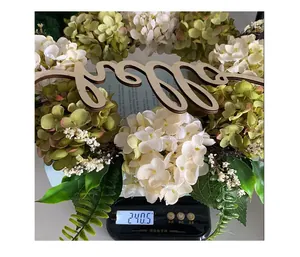 Macro view of artificial hydrangea flower wreath with hello sign weighing 240.5g