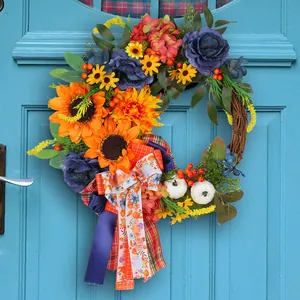 Handcrafted autumn wreath with blue roses and sunflowers for front door festival decoration
