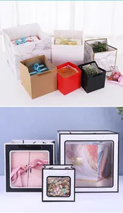 Detailed view of various colorful square paper gift bags with handles and windows