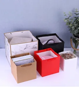 Assorted square paper gift bags with wide bottoms in various colors and marble patterns