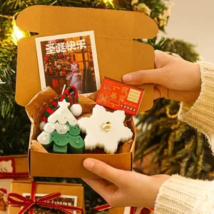 Christmas scented candle gift box with tree and snowflake shapes in kraft packaging