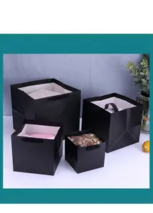 Set of four black square kraft paper gift bags with durable handles in various sizes