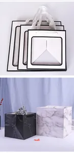 Square gift bags with wide bottom in minimalist white and marble stone patterns