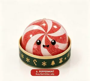 Close-up of peppermint rosy red glitter jelly squishy toy in festive Christmas gift box set