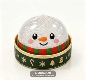 Close-up of icy clear-white glitter snowman jelly squishy toy in a green gift box