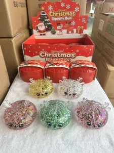 Juguetes squishy de Navidad con purpurina y astas de reno en una caja de regalo festiva