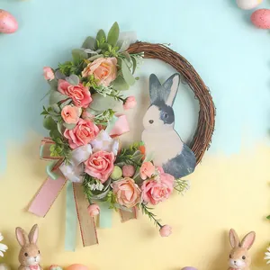 Osterkranz mit rosa Rosen, Blättern und Hasenmotiv für die frühlingshafte Türdekoration