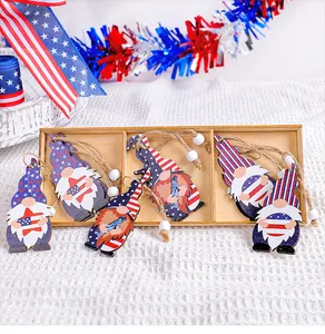 Detail of 4th of July Independence Day wooden gnome hanging ornaments in a 3-slot box.