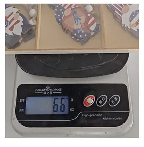 Detailed view of Independence Day wooden gnome ornaments set weighing 66 grams on scale