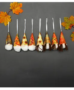 Detailed view of eight autumn harvest gnomes with sunflower and plaid patterns.