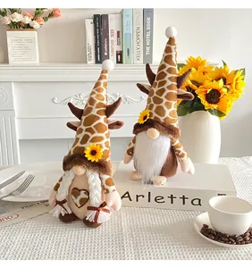 Close-up detail of decorative sunflower gnome plush couple with giraffe print hats