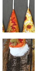 Close-up detail of plush gnome hanging ornament showing sunflower patterns and textures