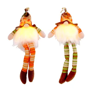 Glowing Autumn harvest gnomes with long dangling striped legs and festive maple leaf patterned hats