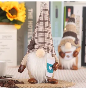 Close-up of a coffee-themed faceless gnome doll with a plaid hat and white beard