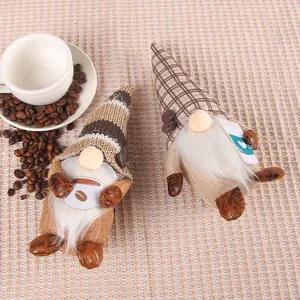 Detail view of coffee-themed faceless gnome dolls featuring knitted hats and white beards