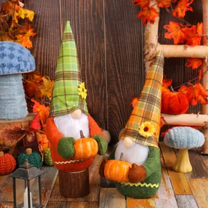 Pair of Harvest Festival plush gnomes holding pumpkins for autumn and Thanksgiving home decoration