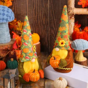Pair of autumn harvest gnomes plush dolls holding pumpkins for festive home decoration