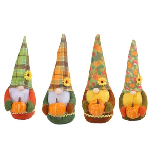 Set of four harvest festival plush gnomes holding pumpkins for fall home decoration