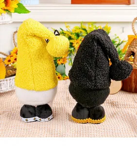 Close-up of two Bee Festival faceless plush gnomes with yellow and black hats for holiday gift decor