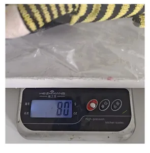Close-up of the bee festival gnome decoration showing its weight of 80g on a digital scale