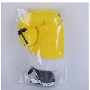 Yellow bee festival faceless gnome plush doll shown inside its protective clear packaging