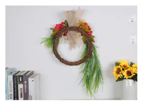 Rustic farmhouse artificial floral wreath with red flowers and green trailing vines