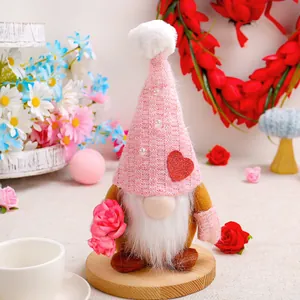 Handcrafted Mother's Day gnome plush doll with pink knitted hat and red heart decoration