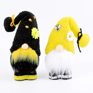 Pair of adorable bee-themed faceless gnome plush dolls for festive holiday decoration