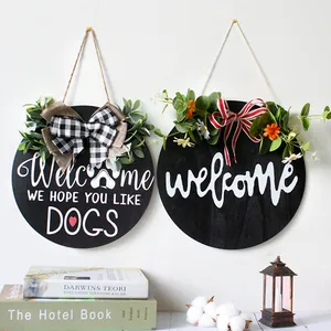 Set of two round wooden welcome signs with bows and greenery for home door wall decoration