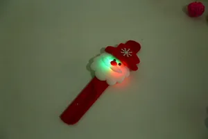 Close-up view of LED glowing Santa Claus slap bracelet for Christmas children decoration