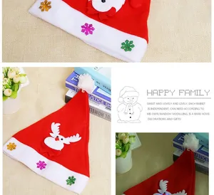 Close-up of children's red plush Christmas hat with reindeer and snowflake details