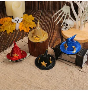 Detailed view of four colorful glittery mini witch hats for Halloween hair styling