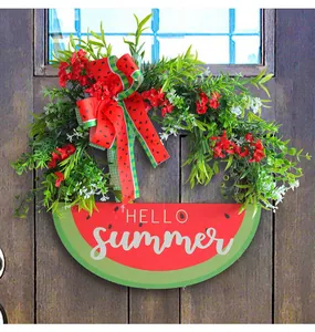 Detailed view of artificial watermelon wreath with 'HELLO SUMMER' sign for front door decor