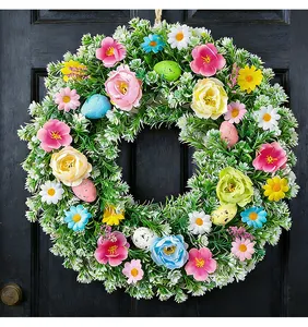 Detailed view of vibrant Easter wreath with colorful eggs and mixed artificial flowers