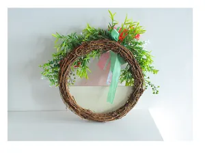 Close-up detail of artificial watermelon wreath on a natural wooden rattan vine ring