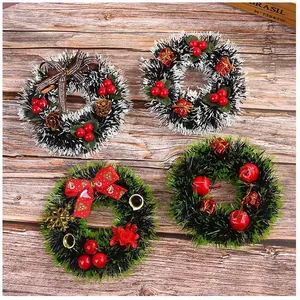 Set of four small Christmas wreaths with festive decorations on rustic wooden background