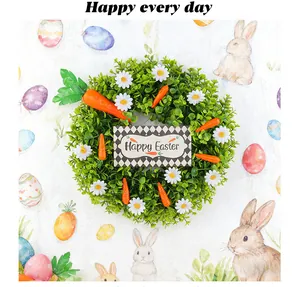Artificial Easter wreath decorated with green leaves, daisies, carrots, and Happy Easter sign.