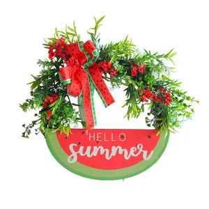 Artificial watermelon wreath with green leaves and red floral accents for summer decor