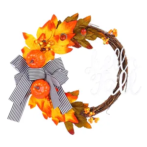 Autumn harvest wreath with maple leaves, pumpkins, and a "hello Fall" sign on twig base.