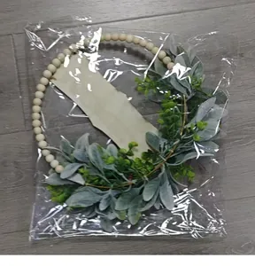 Close-up detail of artificial Easter wreath with lamb's ear leaves and beads