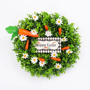 Artificial Easter wreath with daisies, carrots, and a Happy Easter sign for front door decor