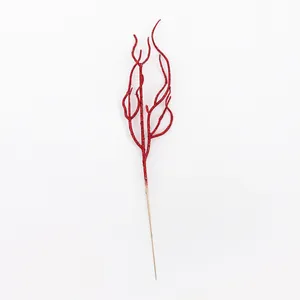 Macro view of a single red glitter branch used for Christmas tree and floral arrangements