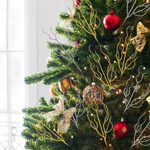 Detailed view of gold and silver glitter Christmas twig ornaments on a festive tree