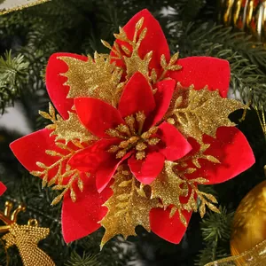Detailed view of red velvet Christmas flower head with sparkling gold glitter